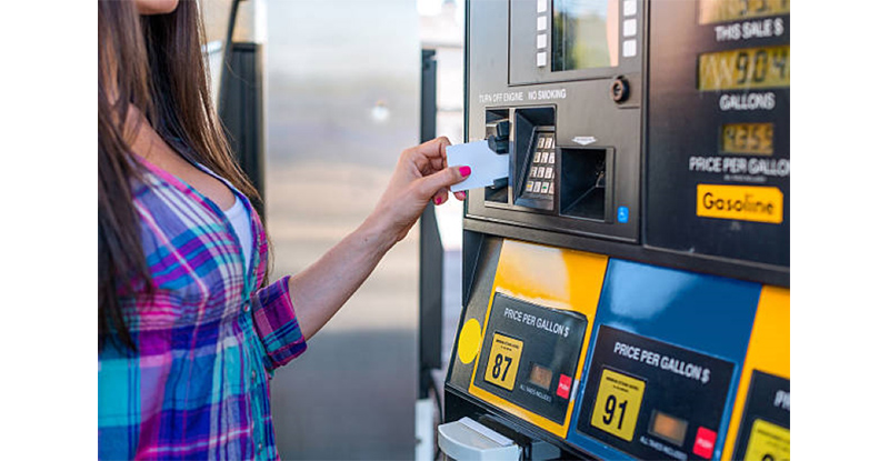 Woman using a company credit card for gas