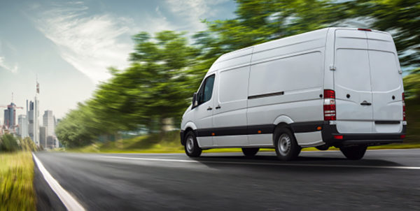 Delivery van delivers in a city that has fleet insurance